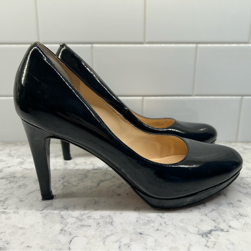 Black patent leather Cole Haan heels with Nike air technology. Super comfy!